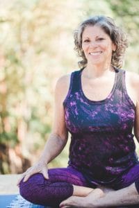 picture of a woman at menopause and perimenopause doing yoga