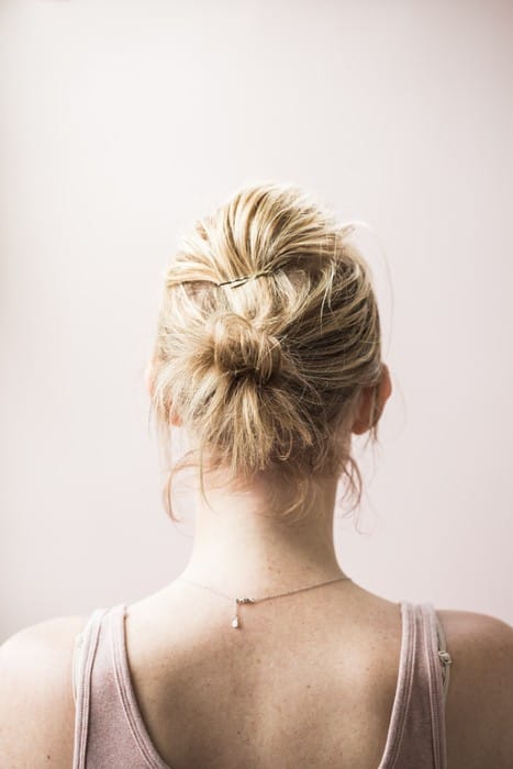 picture of the back of a woman's head who is wondering about lab testing for hair loss