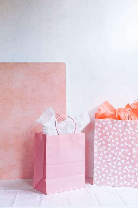picture of pink gift bags that hold naturopathic doctor gift cards or gift certificates